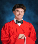 young man in a red graduation gown for senior pictures