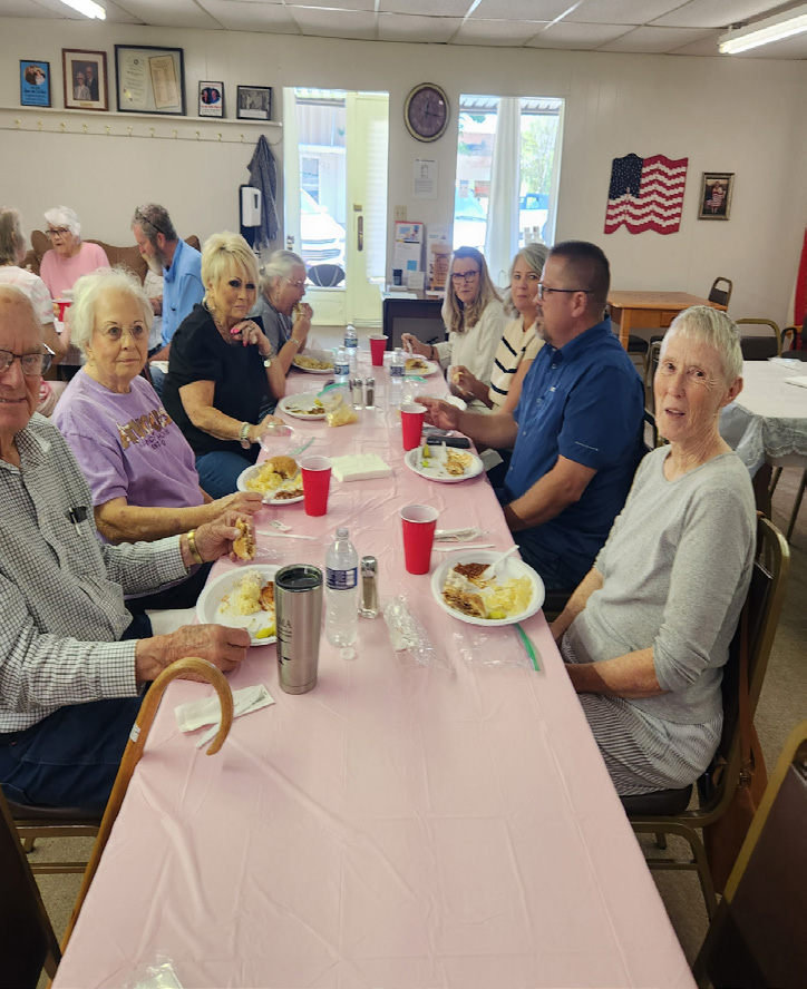 Group of Walters Senior Citizens Center members and board members gathered together indoors for their annual meeting.