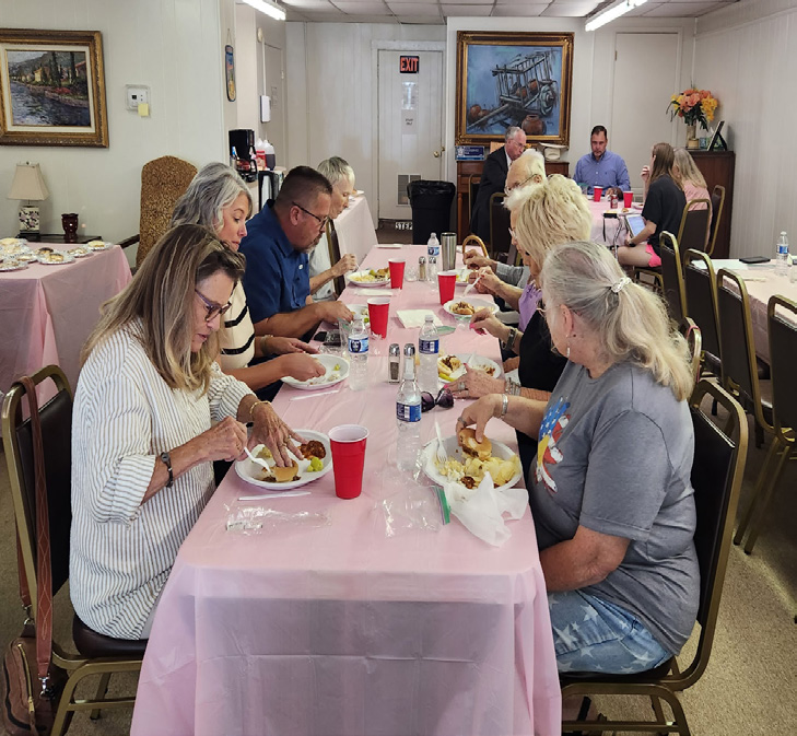 Group of Walters Senior Citizens Center members and board members gathered together indoors for their annual meeting.