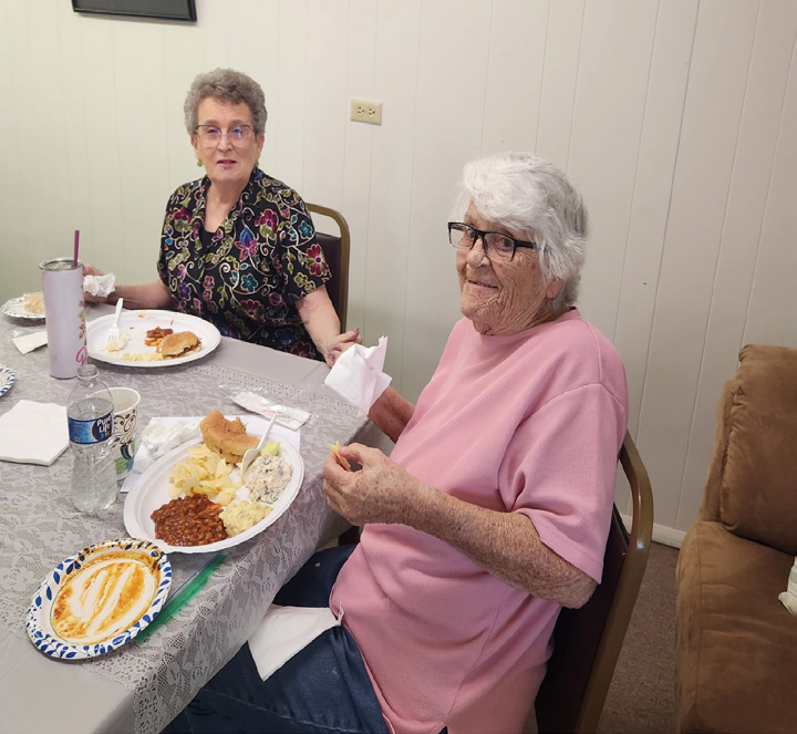 Group of Walters Senior Citizens Center members and board members gathered together indoors for their annual meeting.
