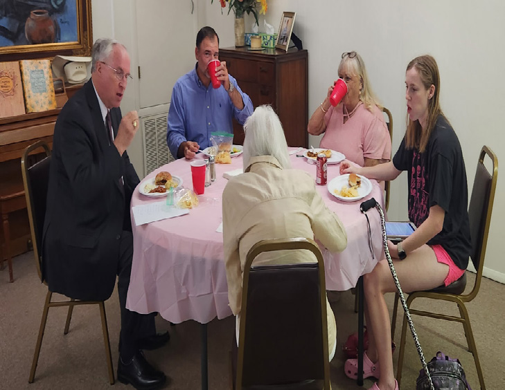 Group of Walters Senior Citizens Center members and board members gathered together indoors for their annual meeting.