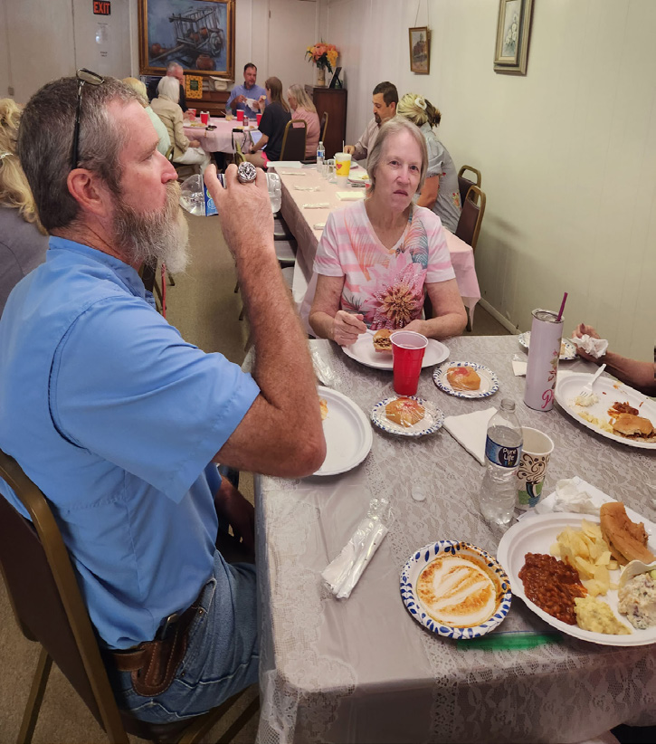 Group of Walters Senior Citizens Center members and board members gathered together indoors for their annual meeting.